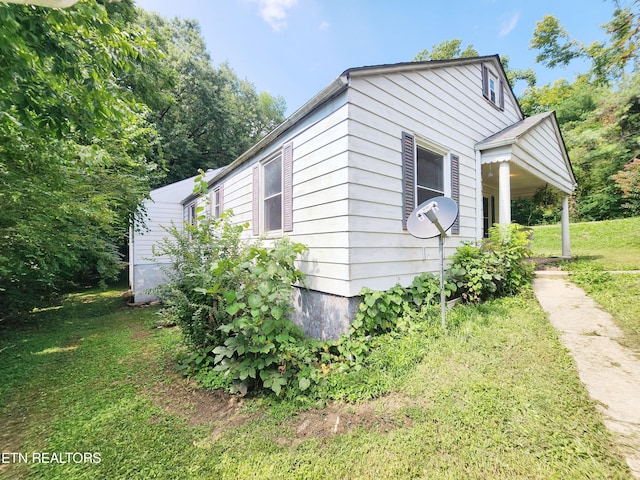 view of home's exterior featuring a yard