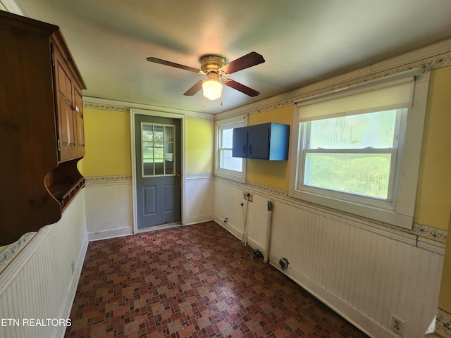 interior space featuring ceiling fan