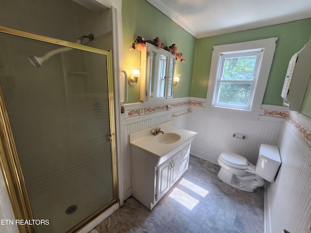 bathroom featuring vanity, ornamental molding, toilet, and walk in shower