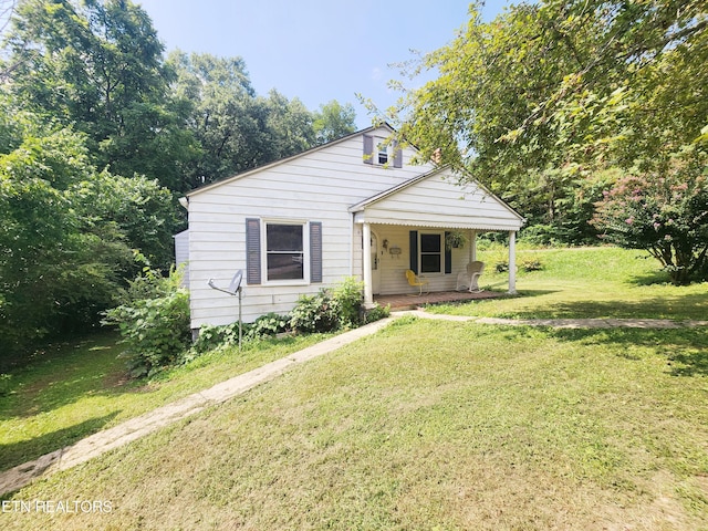 bungalow-style house with a front yard and a porch