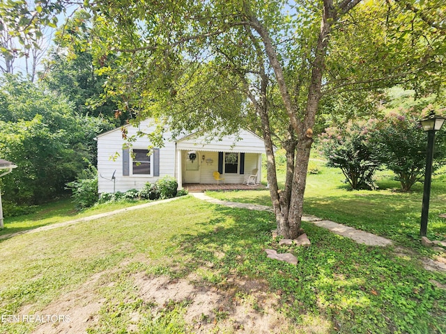 view of front facade with covered porch and a front lawn