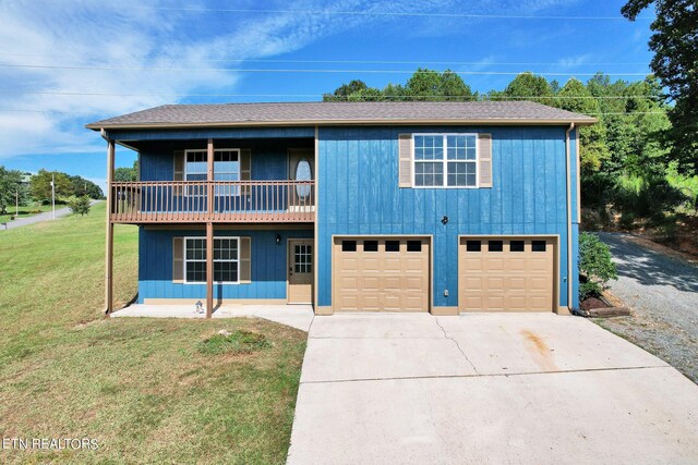 view of front property with a garage and a front lawn