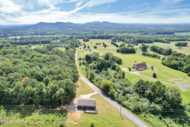 bird's eye view featuring a rural view and a mountain view