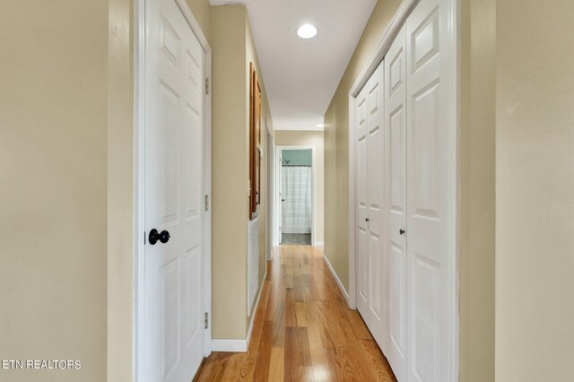 corridor featuring light hardwood / wood-style floors