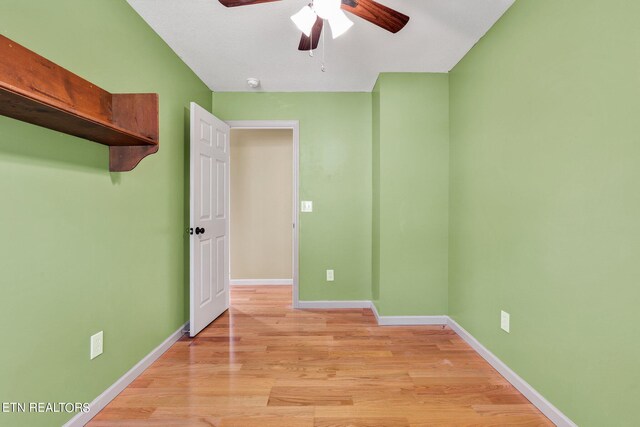 unfurnished bedroom featuring ceiling fan and light wood-type flooring