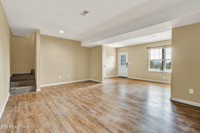 empty room featuring wood-type flooring