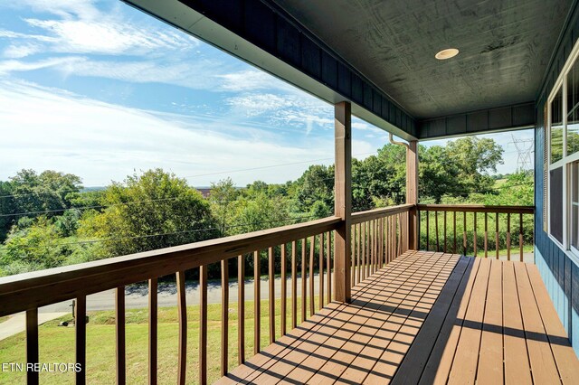 deck featuring a yard