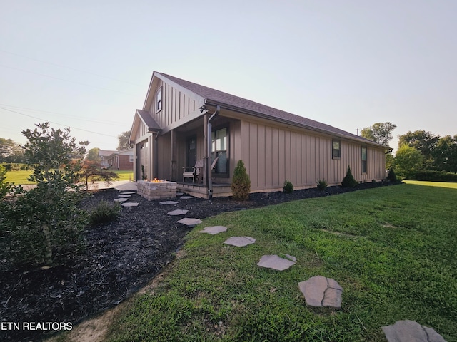 view of property exterior featuring a lawn