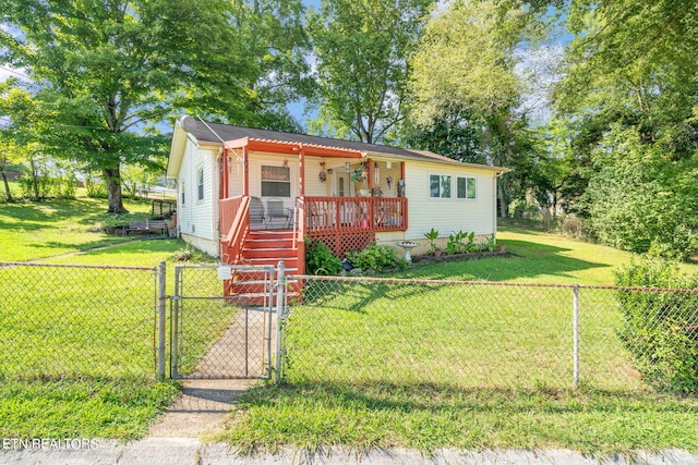 bungalow-style home featuring a fenced front yard, a gate, a front lawn, and a porch