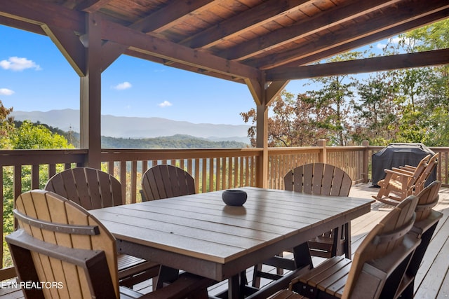 deck featuring a mountain view and grilling area