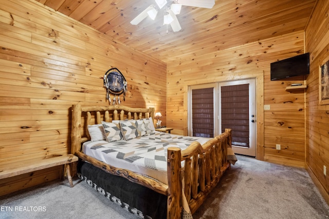 bedroom with carpet floors, wooden walls, ceiling fan, and wood ceiling