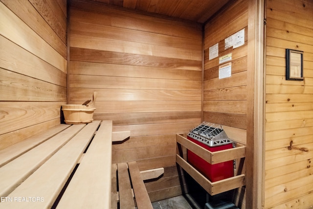 view of sauna / steam room with wood walls and wooden ceiling