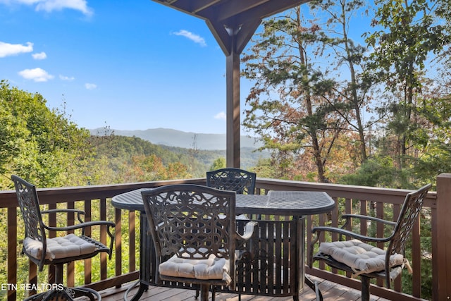 wooden deck with a mountain view