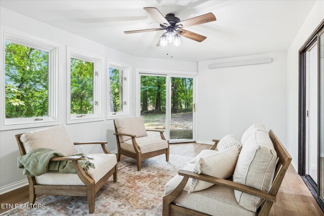 sunroom with ceiling fan and plenty of natural light