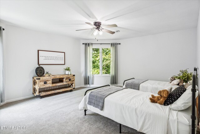 bedroom with ceiling fan and carpet floors