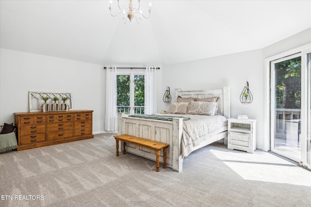 carpeted bedroom featuring access to outside, vaulted ceiling, and a chandelier