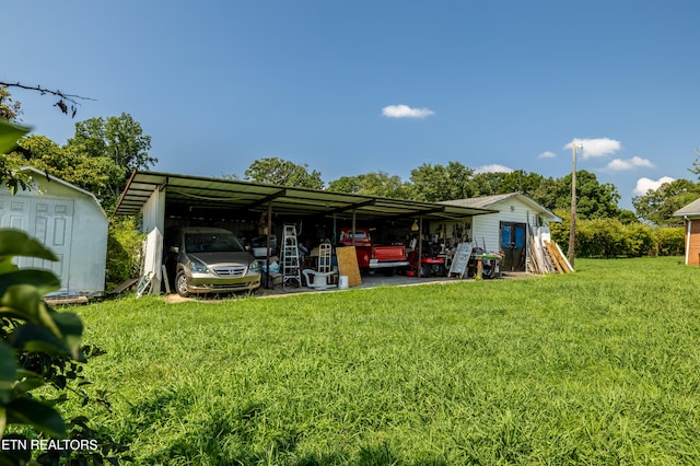 view of yard with a shed and a carport