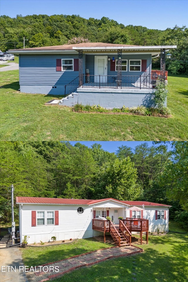 manufactured / mobile home with a front lawn, covered porch, and a wooded view