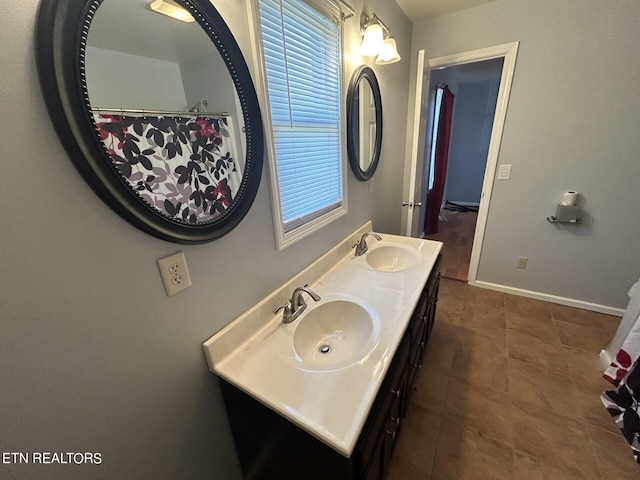 bathroom featuring tile patterned floors and vanity