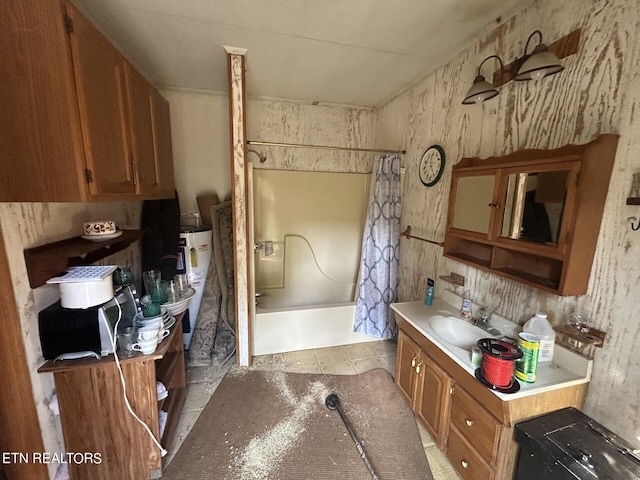 kitchen featuring sink, water heater, and light tile patterned flooring