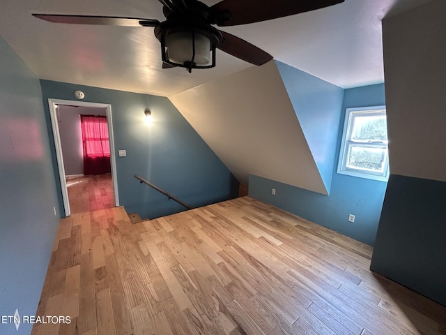 additional living space with ceiling fan, light hardwood / wood-style floors, and lofted ceiling