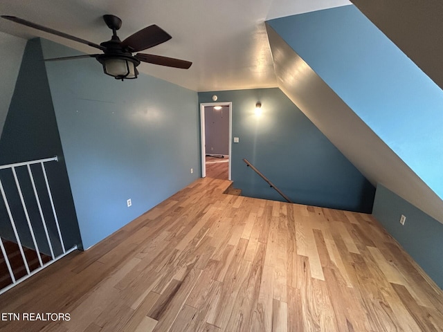 bonus room featuring ceiling fan, lofted ceiling, and hardwood / wood-style floors