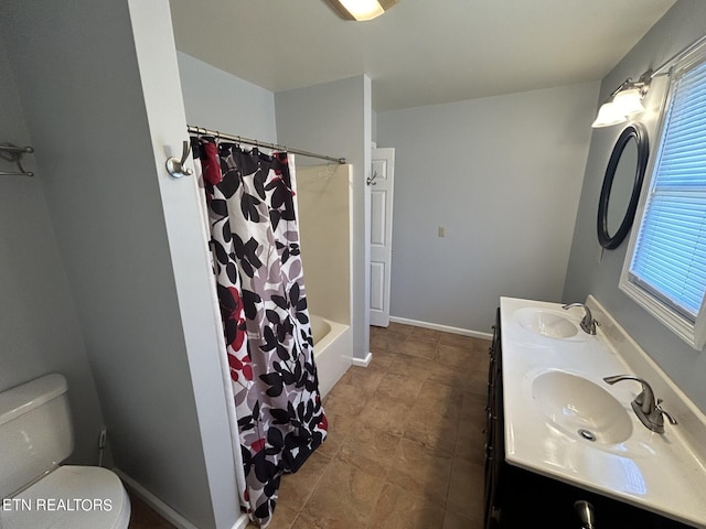 full bathroom featuring tile patterned floors, vanity, shower / tub combo with curtain, and toilet