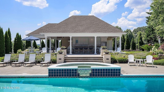 view of pool with an in ground hot tub and a patio area