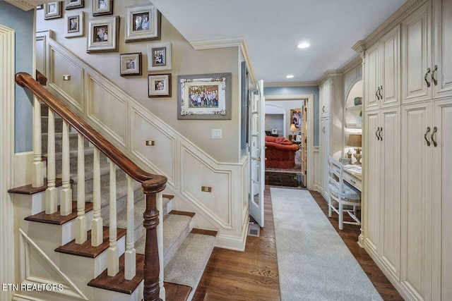 interior space with crown molding and wood-type flooring