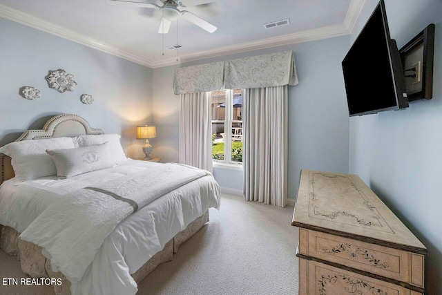 bedroom featuring ceiling fan, crown molding, and light carpet