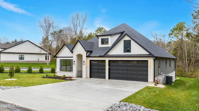 modern farmhouse featuring a garage, concrete driveway, a front yard, and brick siding