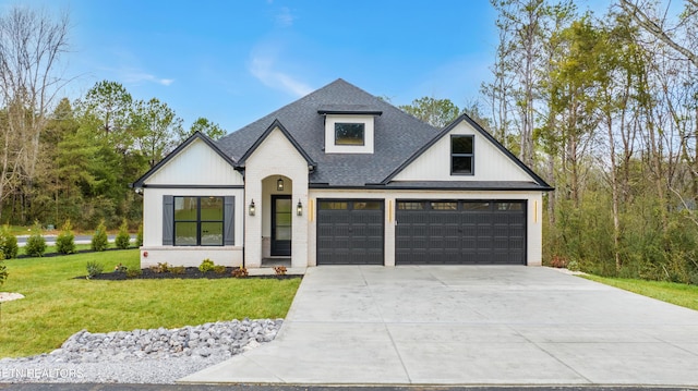 view of front facade with roof with shingles, brick siding, a front lawn, and concrete driveway