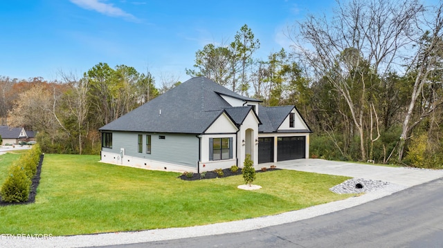 modern inspired farmhouse with driveway, a front lawn, and a shingled roof