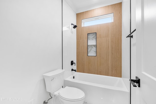 bathroom featuring bathtub / shower combination and toilet