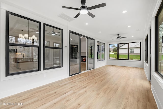 unfurnished sunroom featuring visible vents