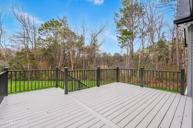 deck featuring a lawn