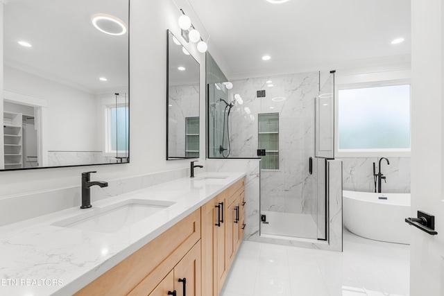 full bathroom featuring a freestanding tub, double vanity, a sink, and a marble finish shower