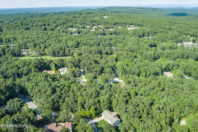 aerial view featuring a wooded view