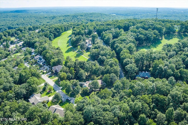 bird's eye view featuring a wooded view