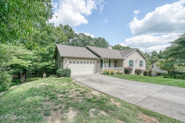 ranch-style house with a garage, driveway, a chimney, covered porch, and a front lawn