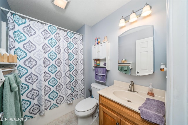 bathroom with toilet, curtained shower, and vanity