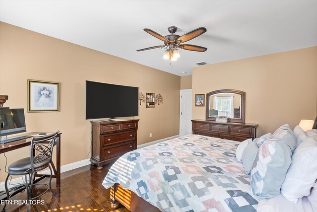 bedroom featuring ceiling fan and dark hardwood / wood-style flooring