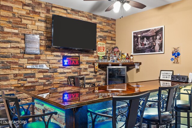 bar featuring ceiling fan and wine cooler