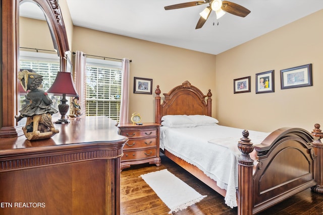 bedroom featuring dark wood-type flooring and ceiling fan