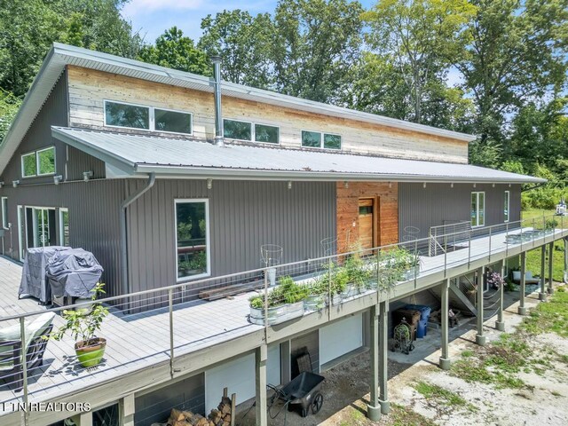 rear view of house with a wooden deck