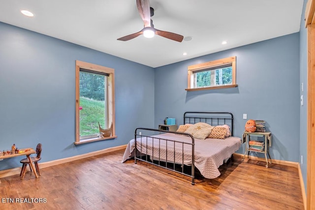 bedroom featuring ceiling fan and wood-type flooring