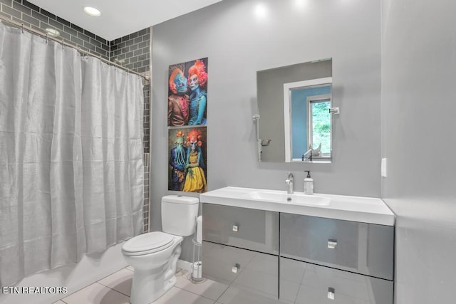 full bathroom featuring vanity, shower / tub combo, tile patterned floors, and toilet