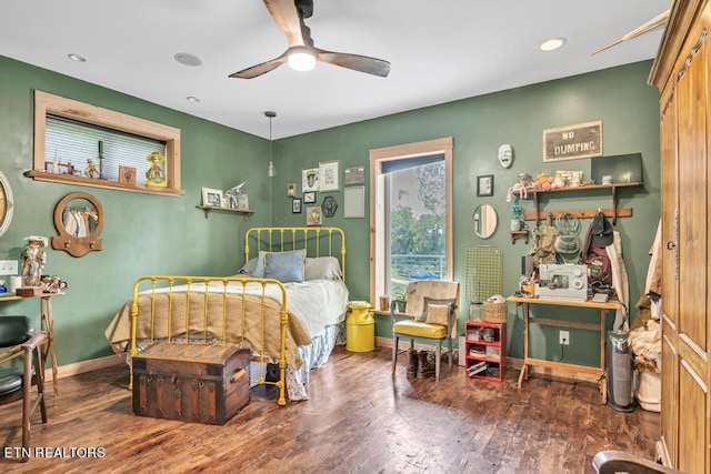 bedroom featuring dark wood-type flooring and ceiling fan