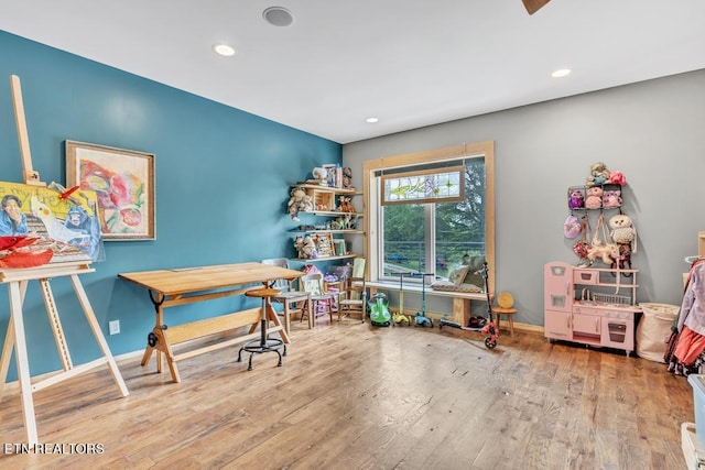 playroom with light wood-type flooring