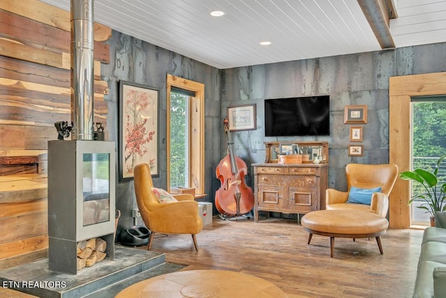 sitting room with wood ceiling and hardwood / wood-style flooring